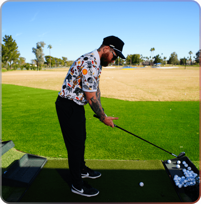 inrange male golfer teeing up